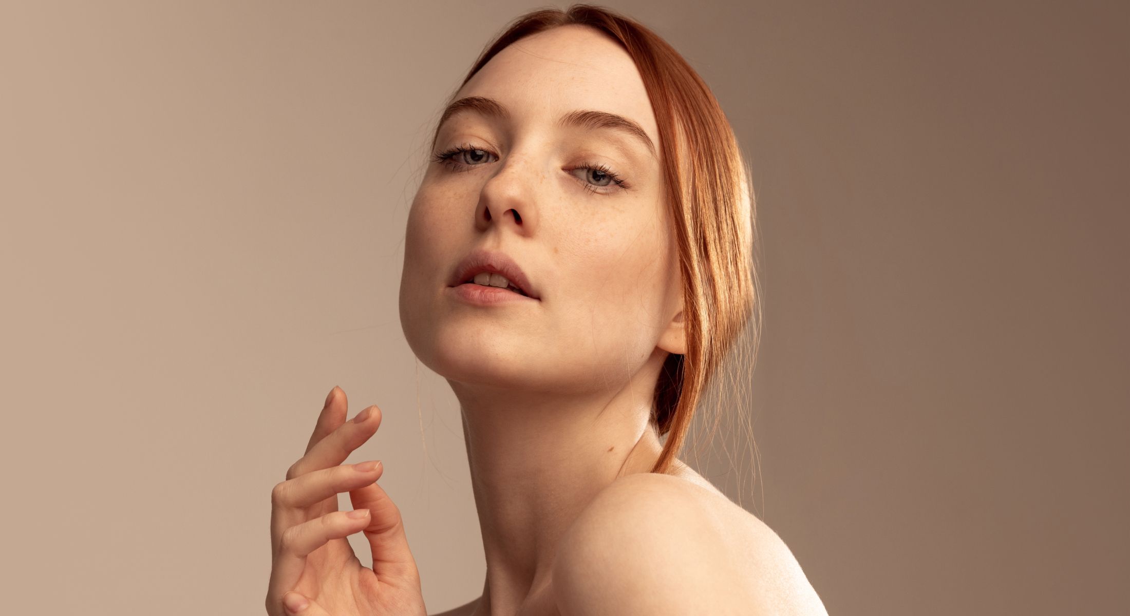 microneedling ardmore feature - woman with red hair posing elegantly